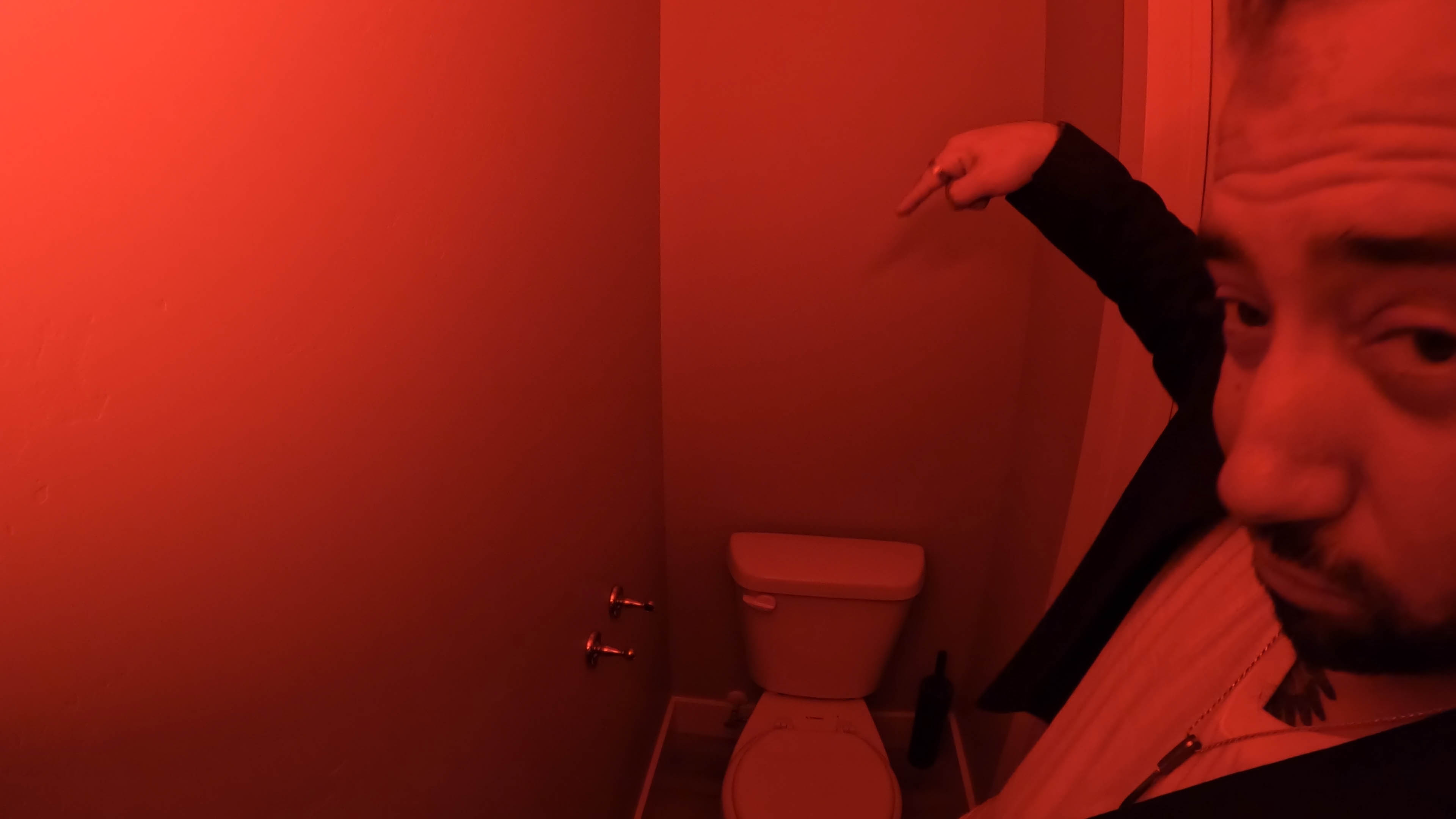 Funny image, someone stole the toilet paper. NateOBash pointing at the bathroom scene. 
